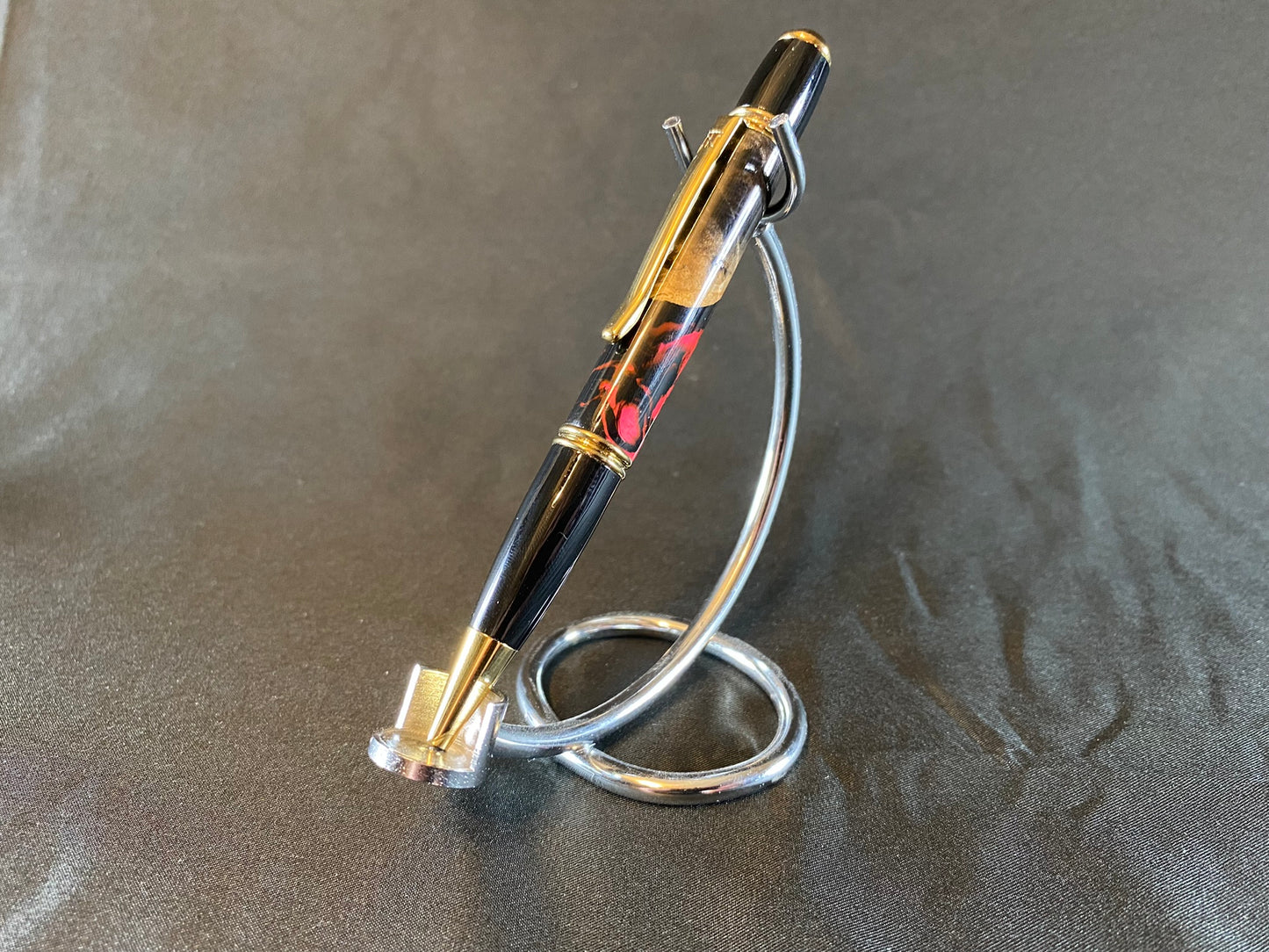 Magenta / Black Buckeye Burl Gold and Titanium Twist Pen